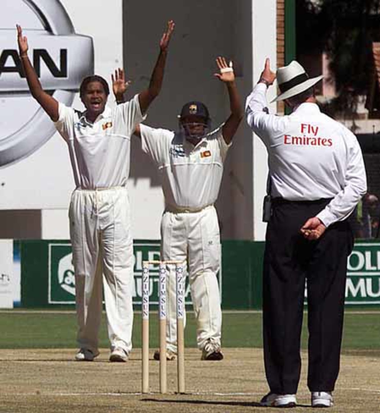 Sri Lanka's Nuwan Zoysa (L) has his appeal for a wicket given by the umpire during the third day of the first test between Zimbabwe and Sri Lanka at the Harare Sports Club