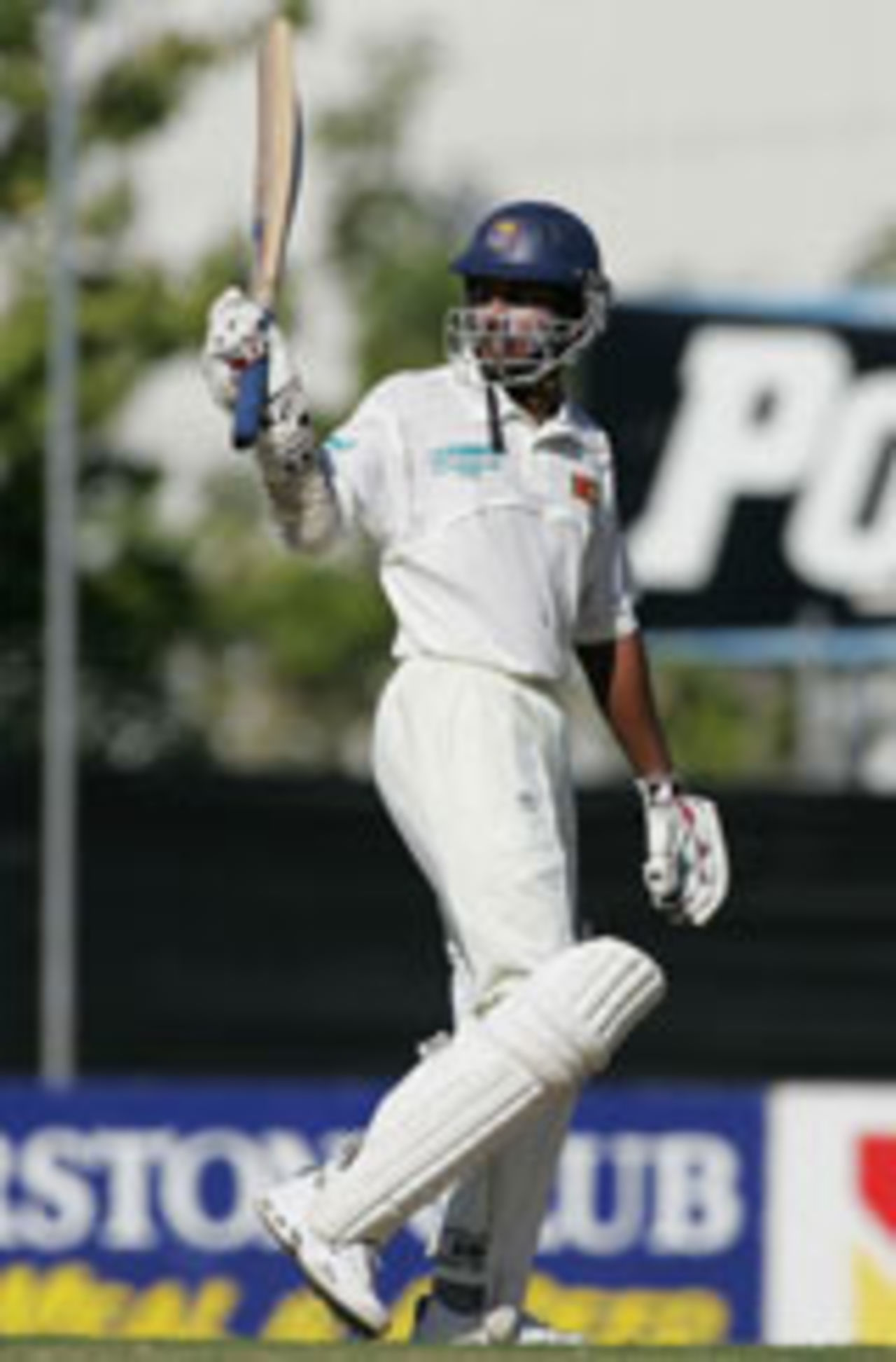 Kumar Sangakkara acknowledges his hundred, NTCM XI v Sri Lankans, Darwin, June 25, 2004