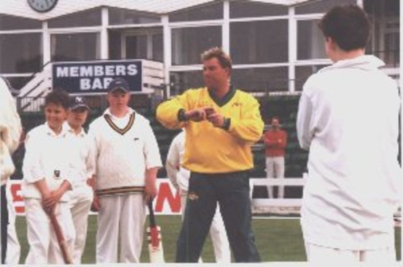 Shane Warne passing on tips to young Welsh cricketers during a coaching clinic at Sophia Gardens in May 1999 as the Australian squad warm-up for the World Cup.
