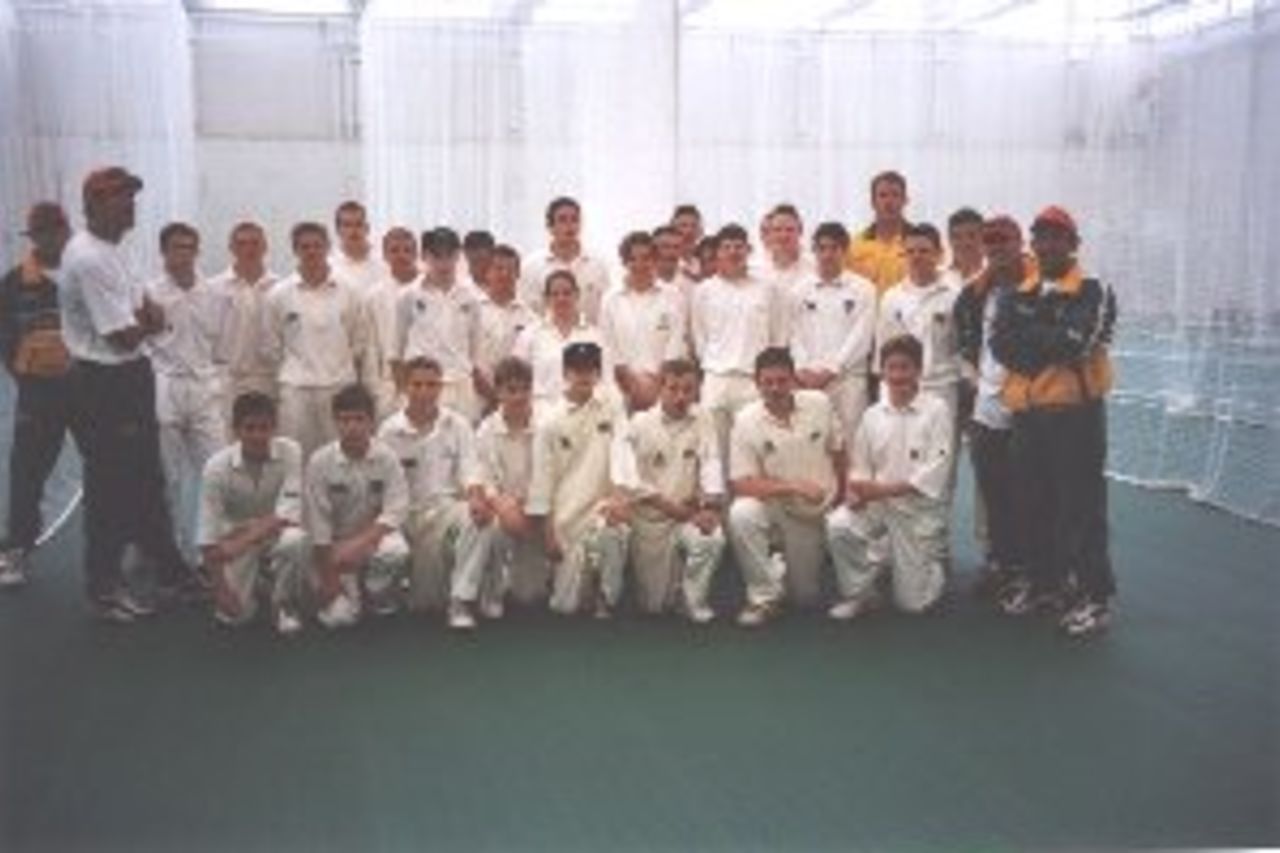 Members of the Australian World Cup squad with young Welsh cricketers inside the Indoor School at the Glamorgan National Cricket Centre.