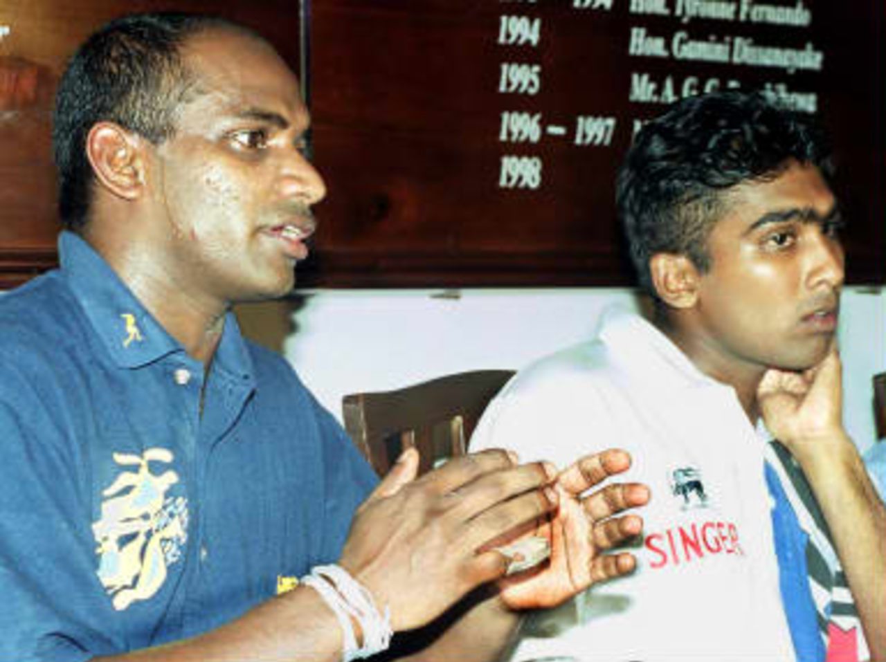 Sri Lanka's new cricket captain, Sanath Jayasuriya (L) and his deputy Mahela Jayawardena speak on 12 July 1999 at their first public appearance after their apointment. Jayasuriya told reporters that cellular telephones  would not be tolerated at pratice after their use was partly to blame for Sri Lanka's dismal showing at this year's cricket World Cup in England