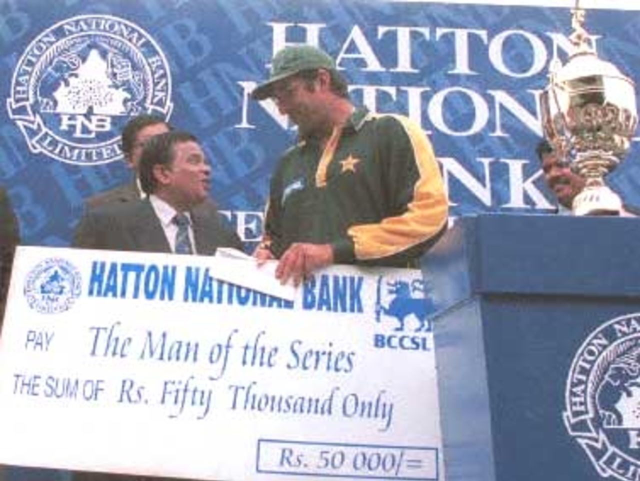Pakistan player Wazim Akram receeives his cheque for man of the series 02 July 2000 after the third and final Test against Sri Lanka was abandoned due to rain. Pakistan won the three test series 2-0. Pakistan in Sri Lanka 1999/00, 3rd Test, Sri Lanka v Pakistan Asgiriya Stadium, Kandy, 28 June - 02 July 2000 (Day  5)