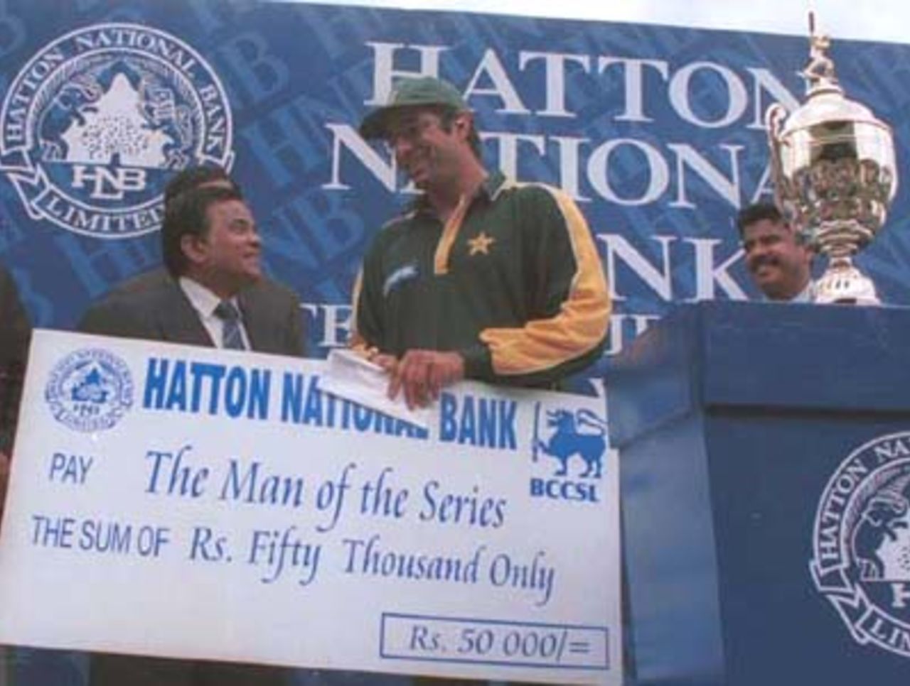 Wasim Akram receives the Man of the Series award during the fifth day of the third and final cricket Test between Sri Lanka and Pakistan in Asgiriya International cricket stadium in Kandy, Sri Lanka on Saturday, July.1, 2000