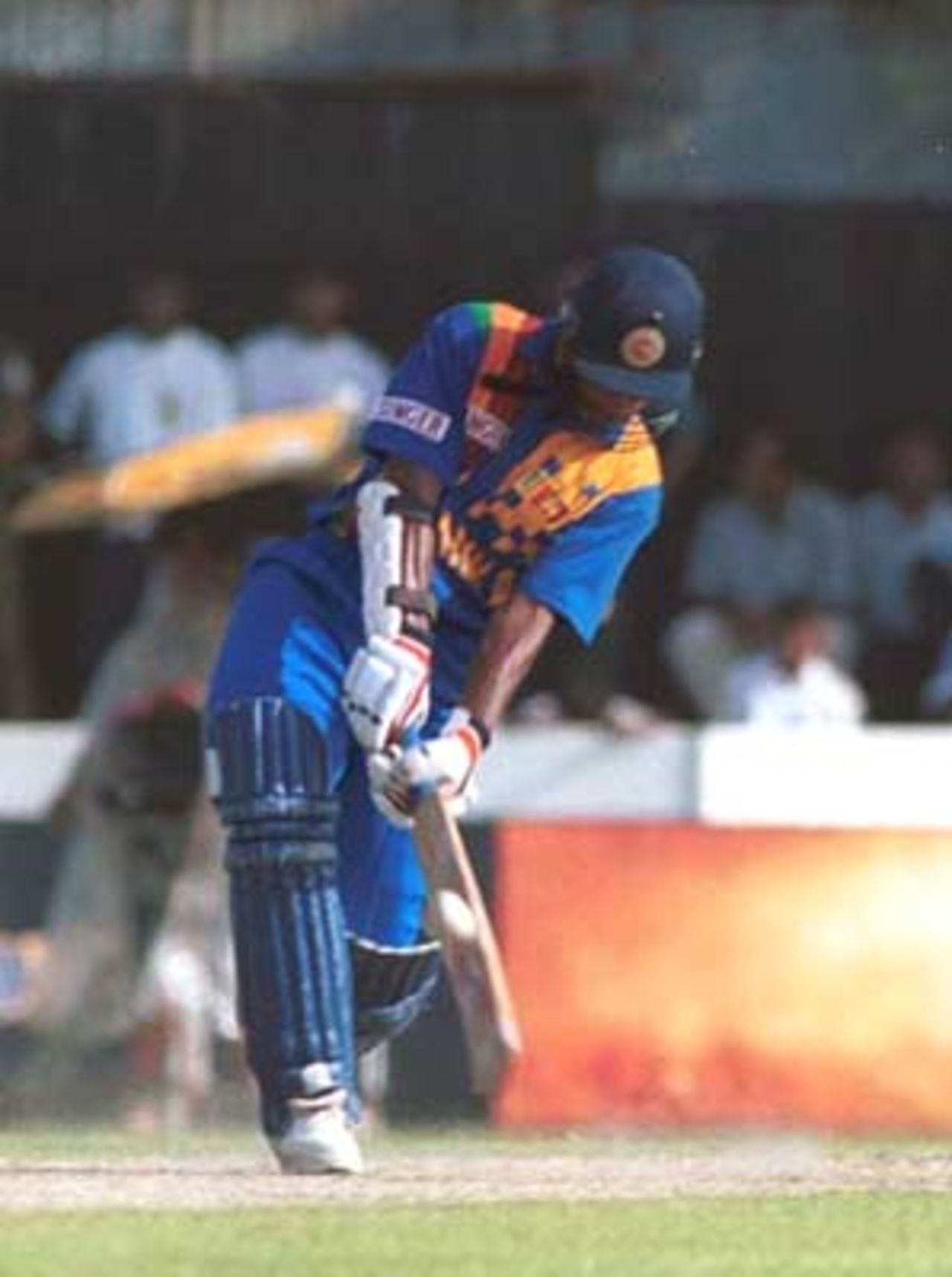 Sangakarra dances down the track to lift the ball over the bowlers head, Singer Triangular Series 2000, 1st Match Pakistan v Sri Lanka, Galle International Stadium, 05 July 2000.