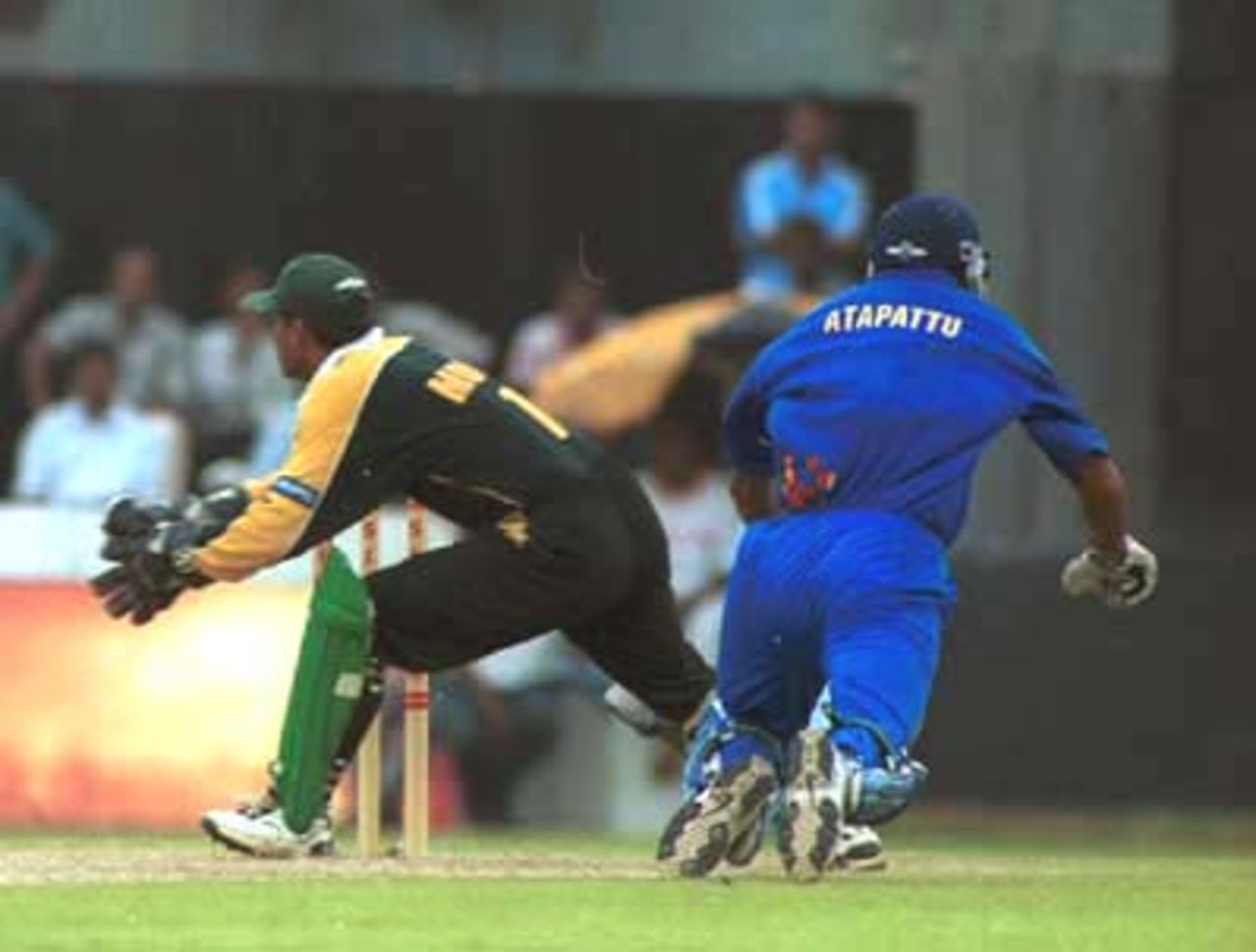 Atapattu manages to reach home as Moin waits to collect the ball, Singer Triangular Series 2000, 1st Match Pakistan v Sri Lanka, Galle International Stadium, 05 July 2000.