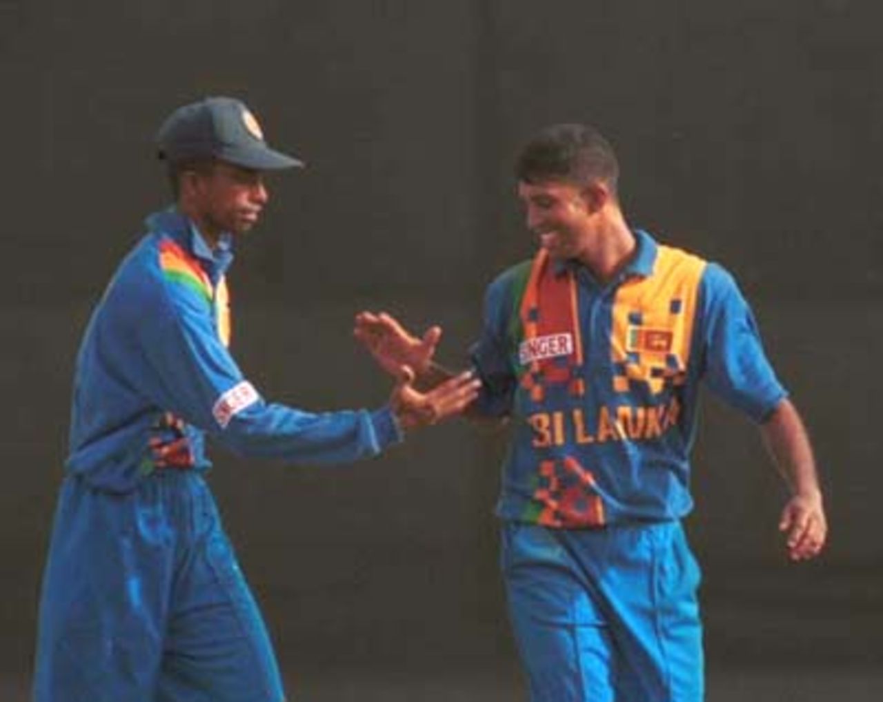 Sri Lankan cricketers celebrate during the Singer Cup Triangular limited overs cricket match against South Africa in Galle International stadium in Galle Sri Lanka on Thursday, July. 6, 2000