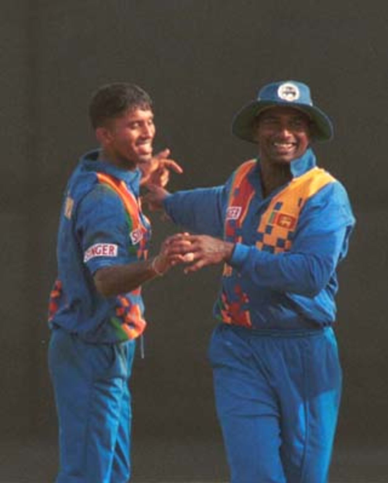 Sri Lankan cricketers celebrate during the Singer Cup Triangular limited overs cricket match against South Africa in Galle International stadium in Galle Sri Lanka on Thursday, July. 6, 2000