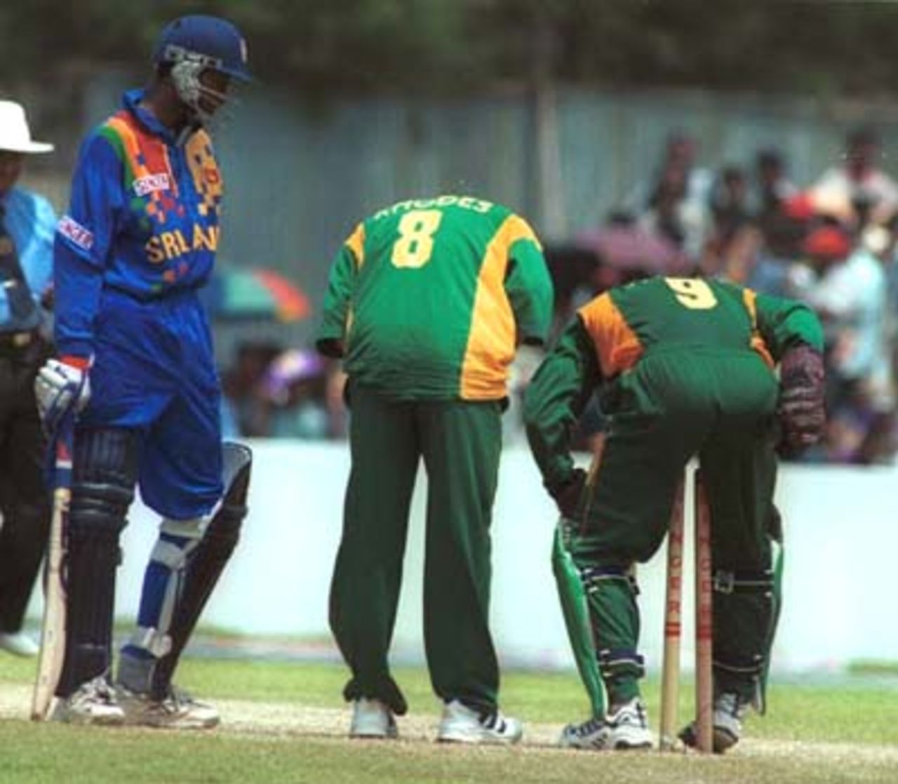 Mark Boucher falls over the stumps during the Singer Cup Triangular limited overs cricket match against South Africa in Galle International stadium in Galle Sri Lanka on Thursday, July. 6, 2000