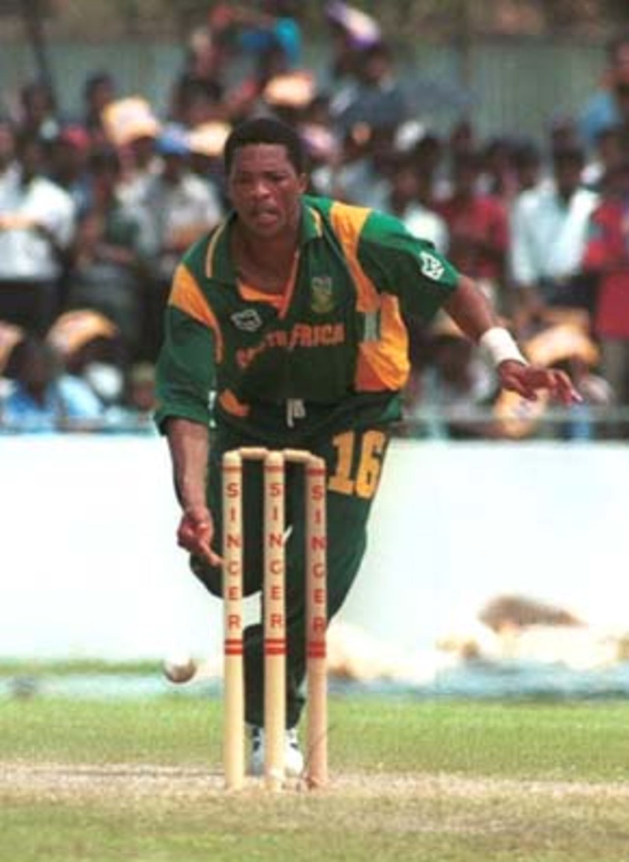 South African bowler Makhaya Ntini removes the bails to get a run out decision against Sri Lankan batsman Kumar Sangakkara,not in the picture, during the Singer Cup Triangular limited overs cricket match against Sri Lanka in Galle International stadium in Galle Sri Lanka on Thursday, July. 6, 2000