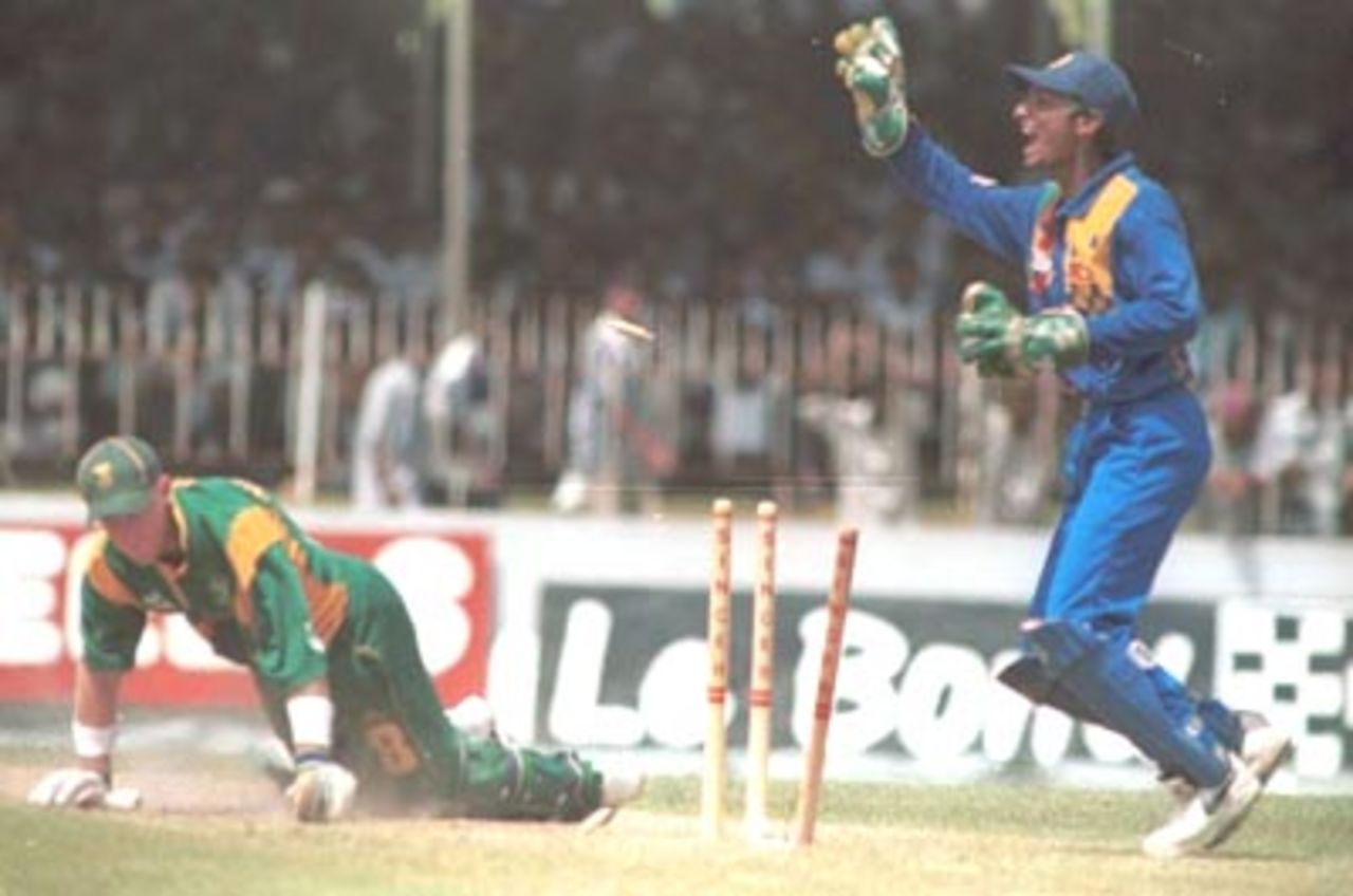 Stumper Sangakkara makes a successfull appeal for a run out against Rhodes. Singer Triangular Series 2000/01, Sri Lanka v South Africa, Sinhalese Sports Club Ground, Colombo 11 July 2000