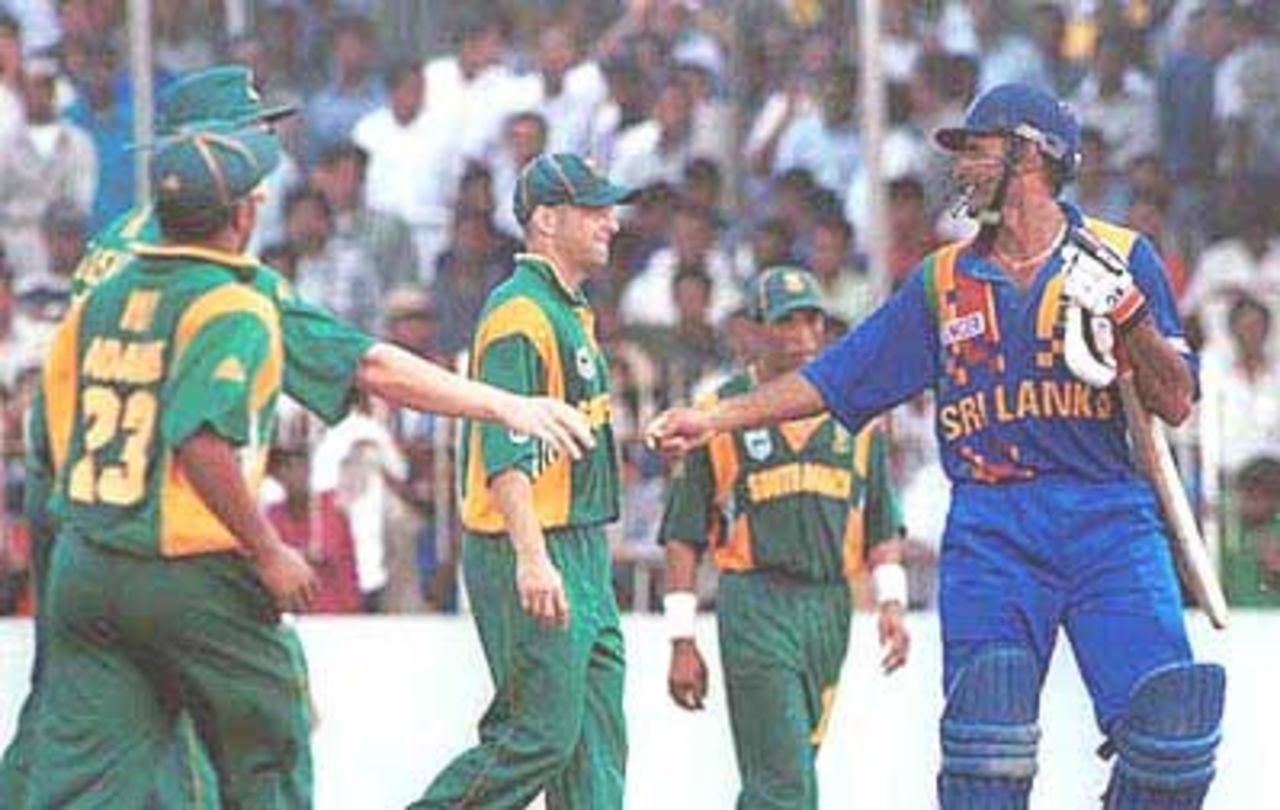Atapattu gets a well deserved handshake from the South African team members, Singer Triangular Series, 2000/01, 5th Match, Sri Lanka v South Africa, Sinhalese Sports Club Ground, Colombo, 11 July 2000.