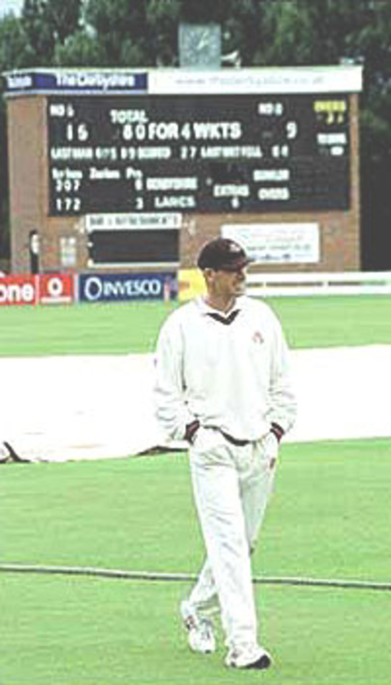 John Crawley leaves the field after the match was abandoned, PPP healthcare County Championship Division One, 2000, Derbyshire v Lancashire, County Ground, Derby, 07-10 July 2000 (Day 4).