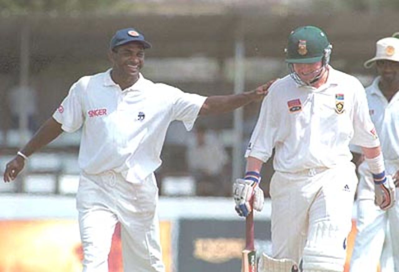 Daryll Cullinan and Sanath Jayasuriya share a lighter moment during the third day of the first Test, South Africa in Sri Lanka, 2000/01, 1st Test, Sri Lanka v South Africa, Galle International Stadium, 20-24 July 2000 (Day 3).