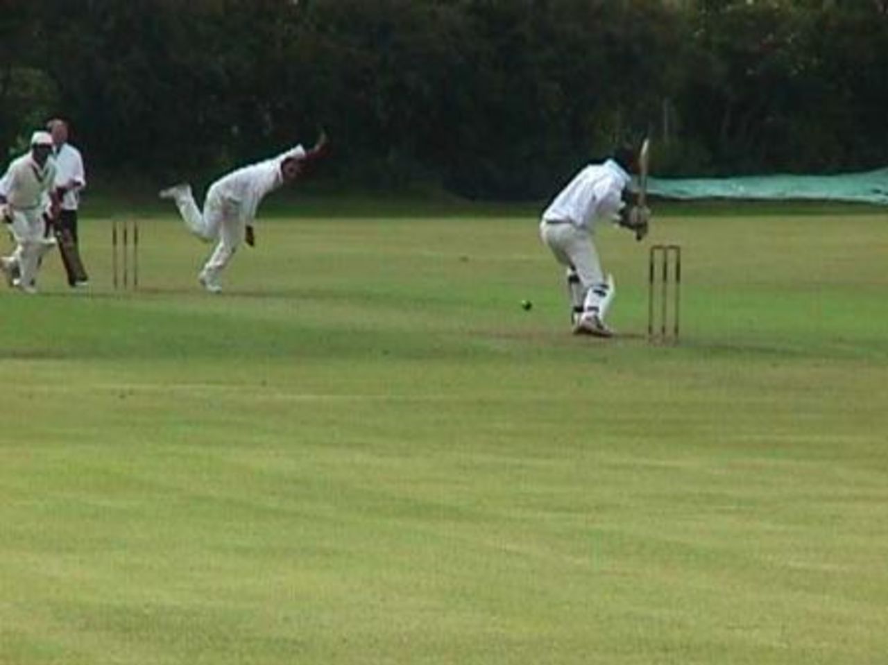 Accrington's Tariq Hussain drives Maboob Hussain through extra cover at West End