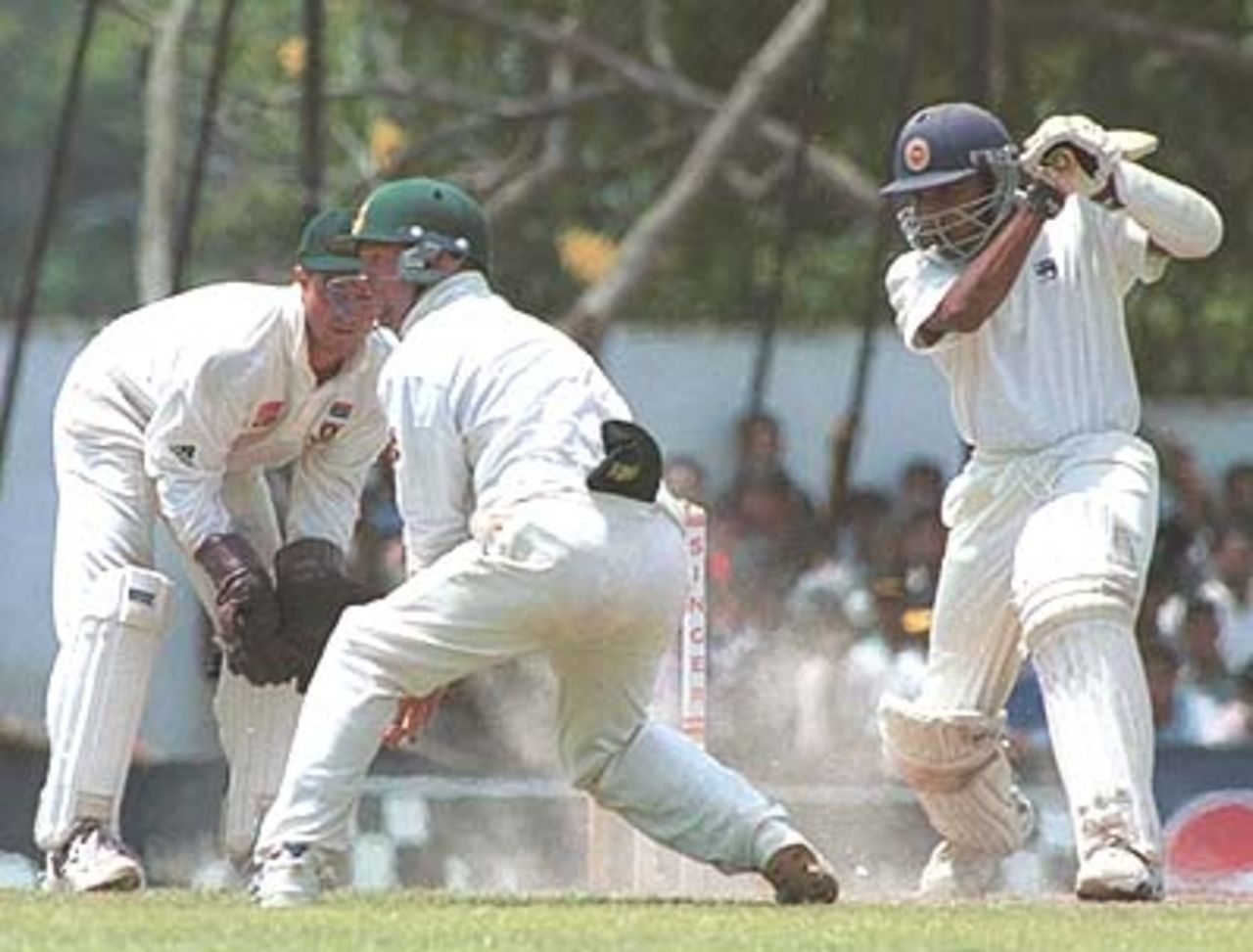 Mahela Jayawardane laces the ball through the offside as Boucher and Rhodes look on. South Africa in Sri Lanka 2000/01, 2nd Test, Sri Lanka v South Africa Asgiriya Stadium, Kandy, 30 July-03 August 2000 (Day 2)