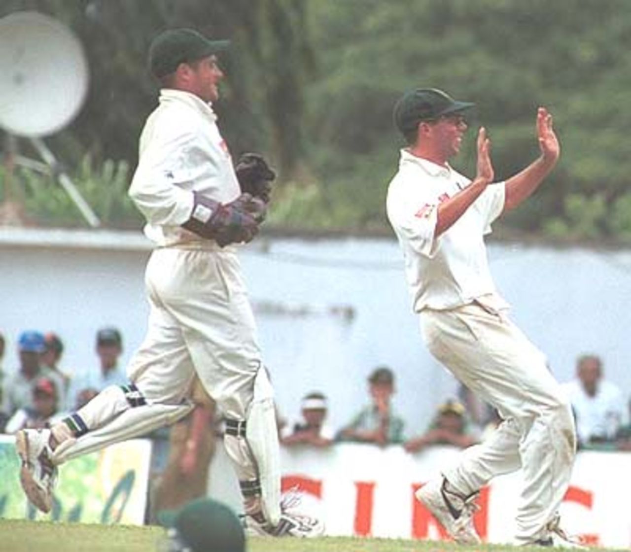 Boje and Boucher rush forward to celebrate the fall of a Sri Lankan wicket. South Africa in Sri Lanka 2000/01, 2nd Test, Sri Lanka v South Africa Asgiriya Stadium, Kandy, 30 July-03 August 2000 (Day 2)