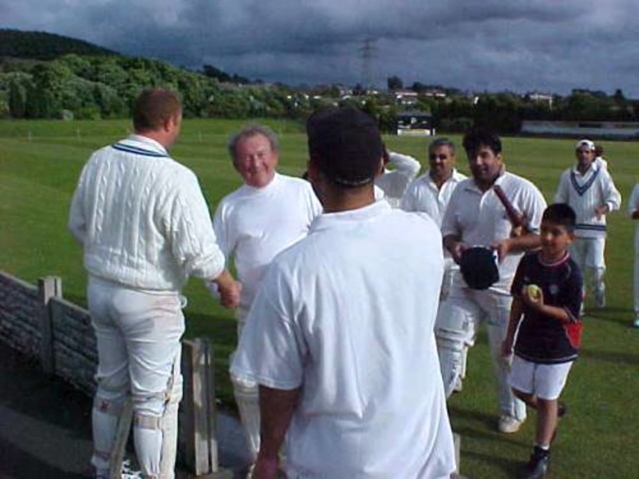 The Accrington A batsmen leave the field in triumph