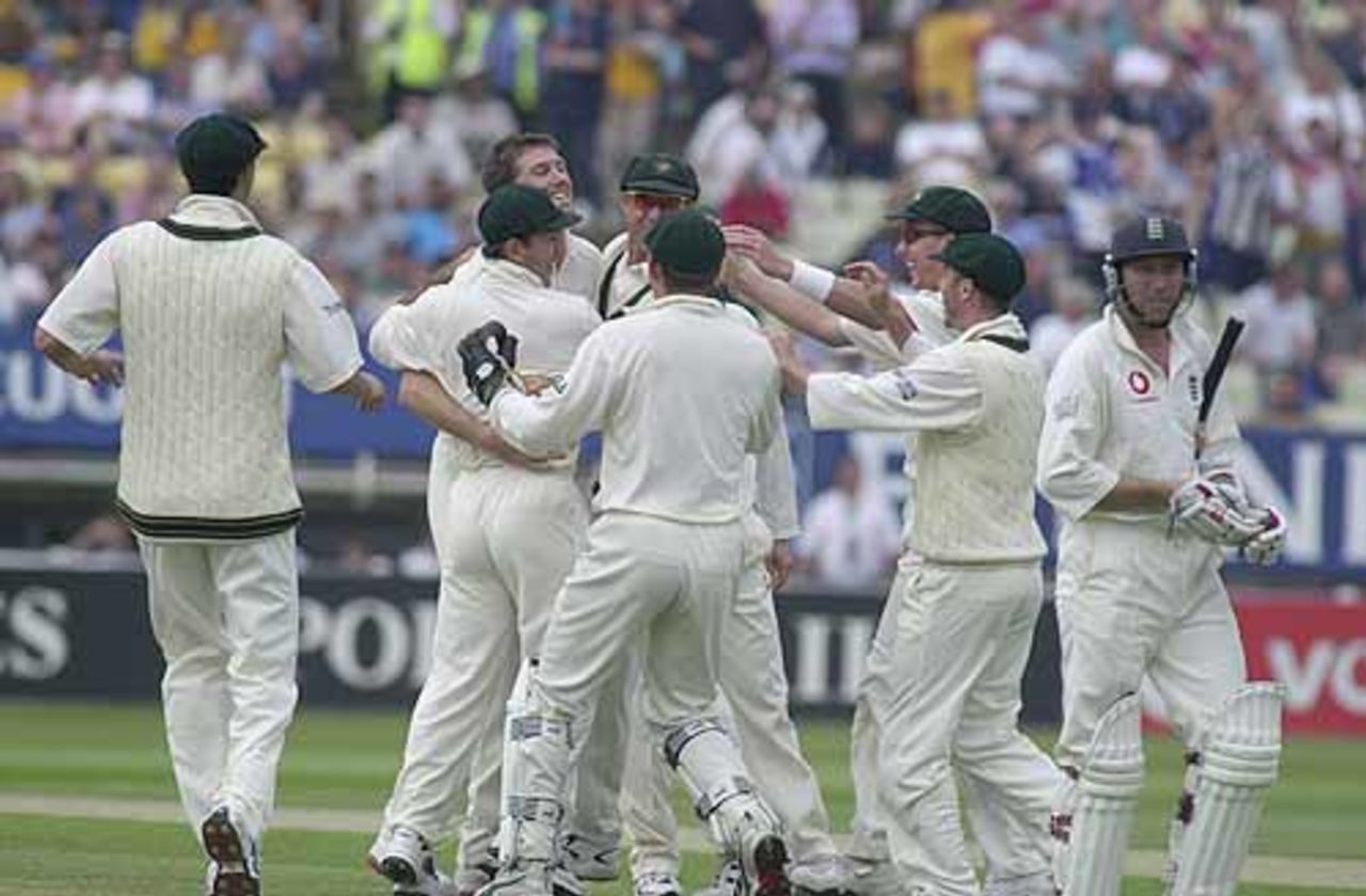 Atherton trudges off as Glenn McGrath celebrates his wicket