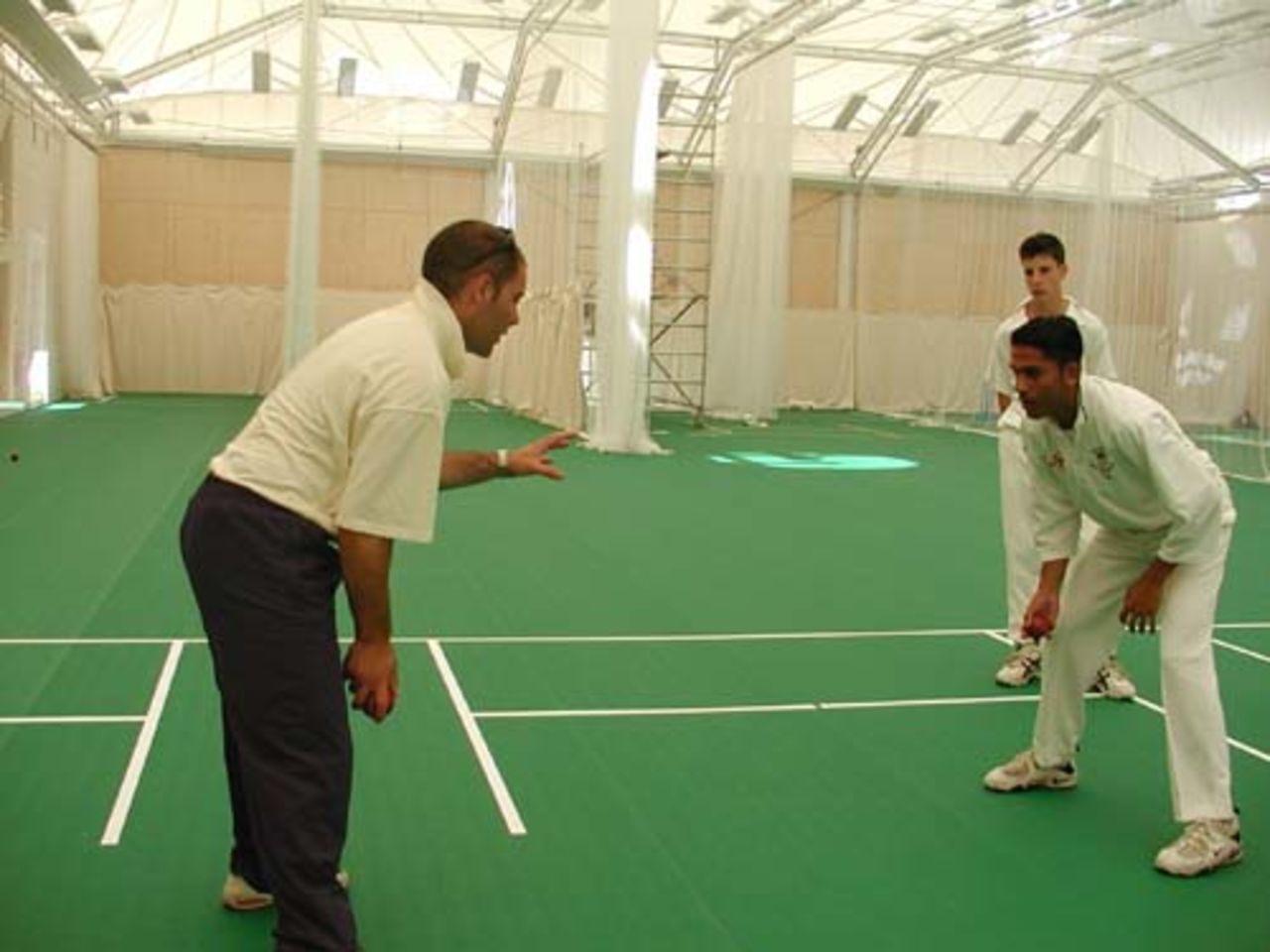 Mark Garaway takes more fielding practice at the indoor school