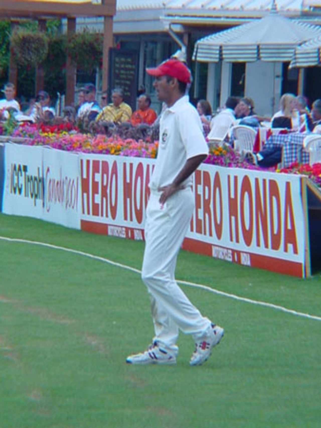 Canadian left arm orthodox spin bowler Barry Seebaran looks to the middle as he fields at long off. ICC Trophy 2001: Canada v Scotland, Toronto Cricket, Skating and Curling Club, 17 July 2001.