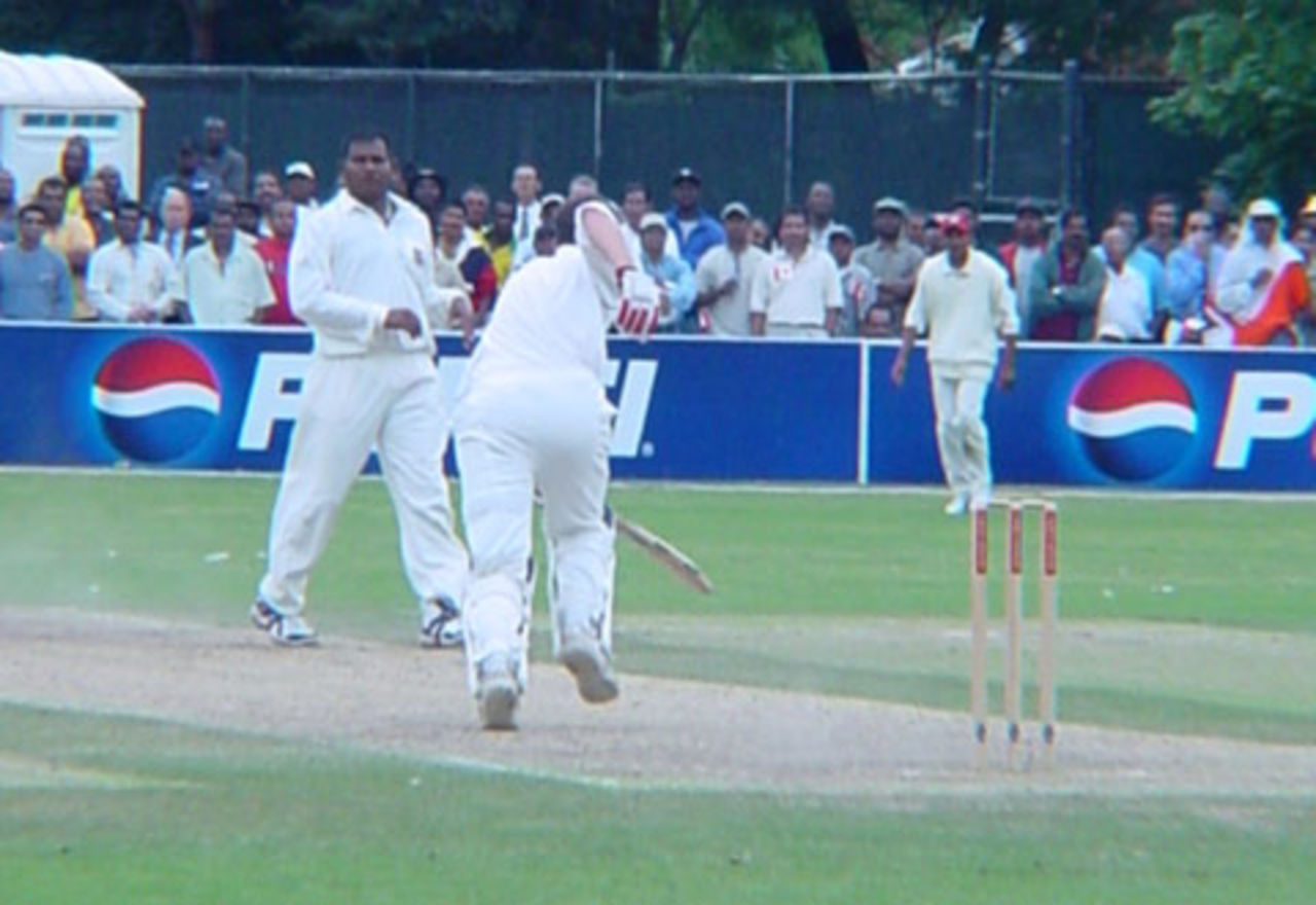 Scottish batsman Craig Wright manages to set off for a run after being tangled up by a good delivery from Canadian medium fast bowler Sanjay Thuraisingham. Wright was eventually dismissed, bowled by Thuraisingham for 25. ICC Trophy 2001: Canada v Scotland at Toronto Cricket, Skating and Curling Club, 17 July 2001.