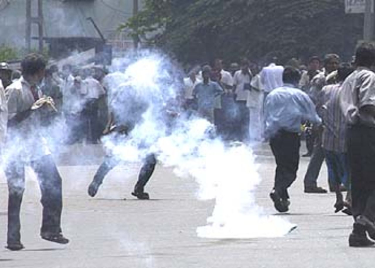 19 July 2001, Police fire teargas to disperse angry demonstrators on the streets of Colombo