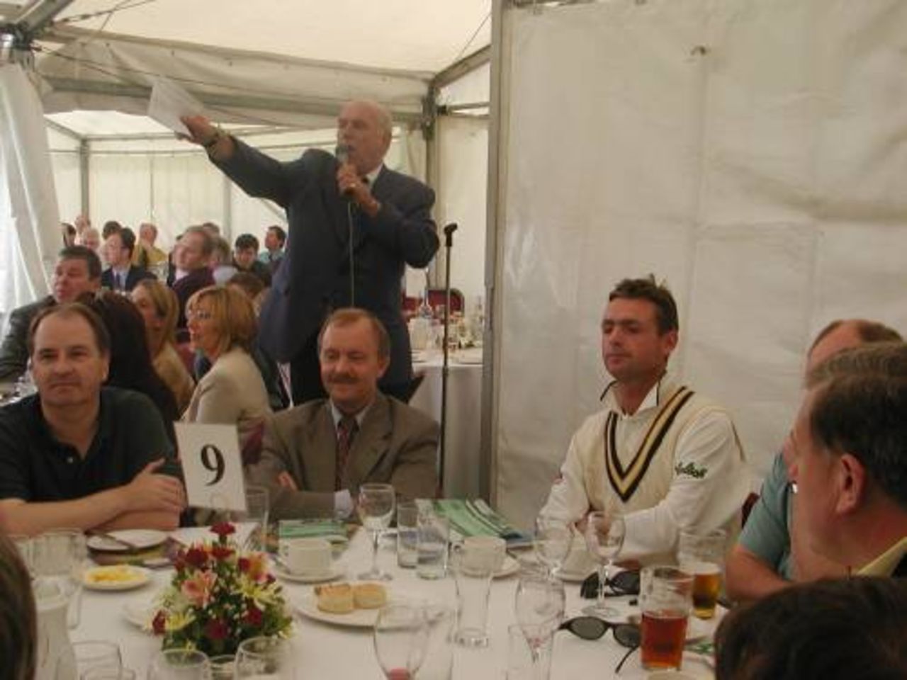 John Stephenson watches as Dennis Bundy calls the auction