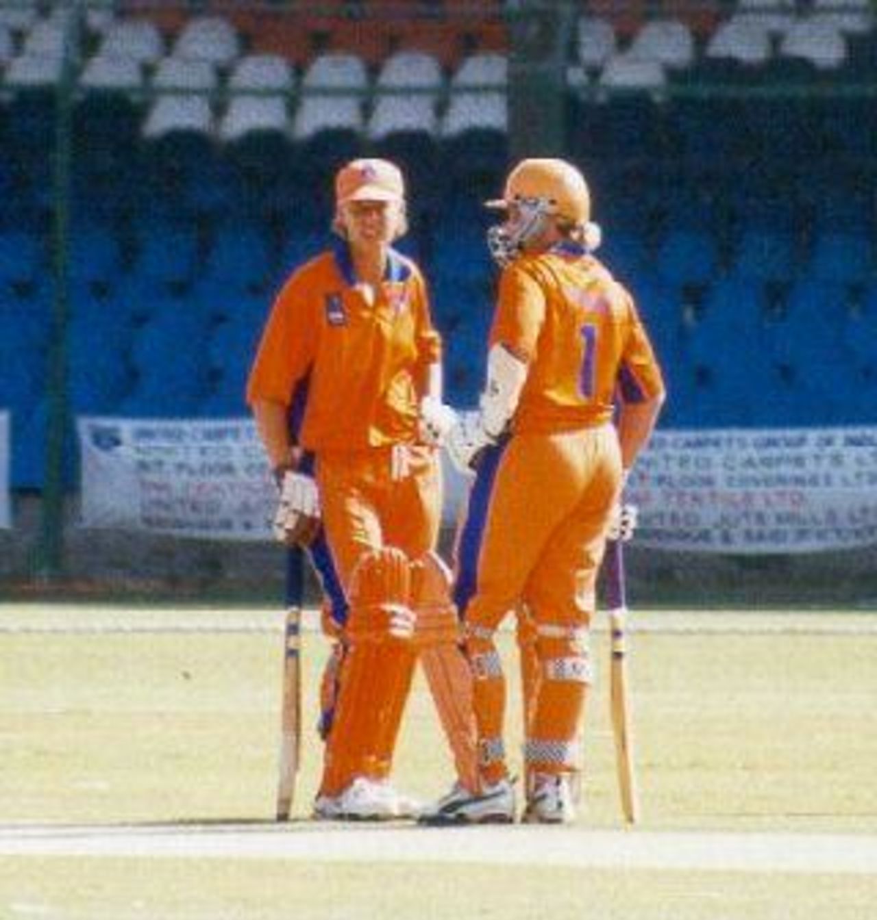 Caroline Salomons and Pauline te Beest talking during  a match against Pakistan, April 2001