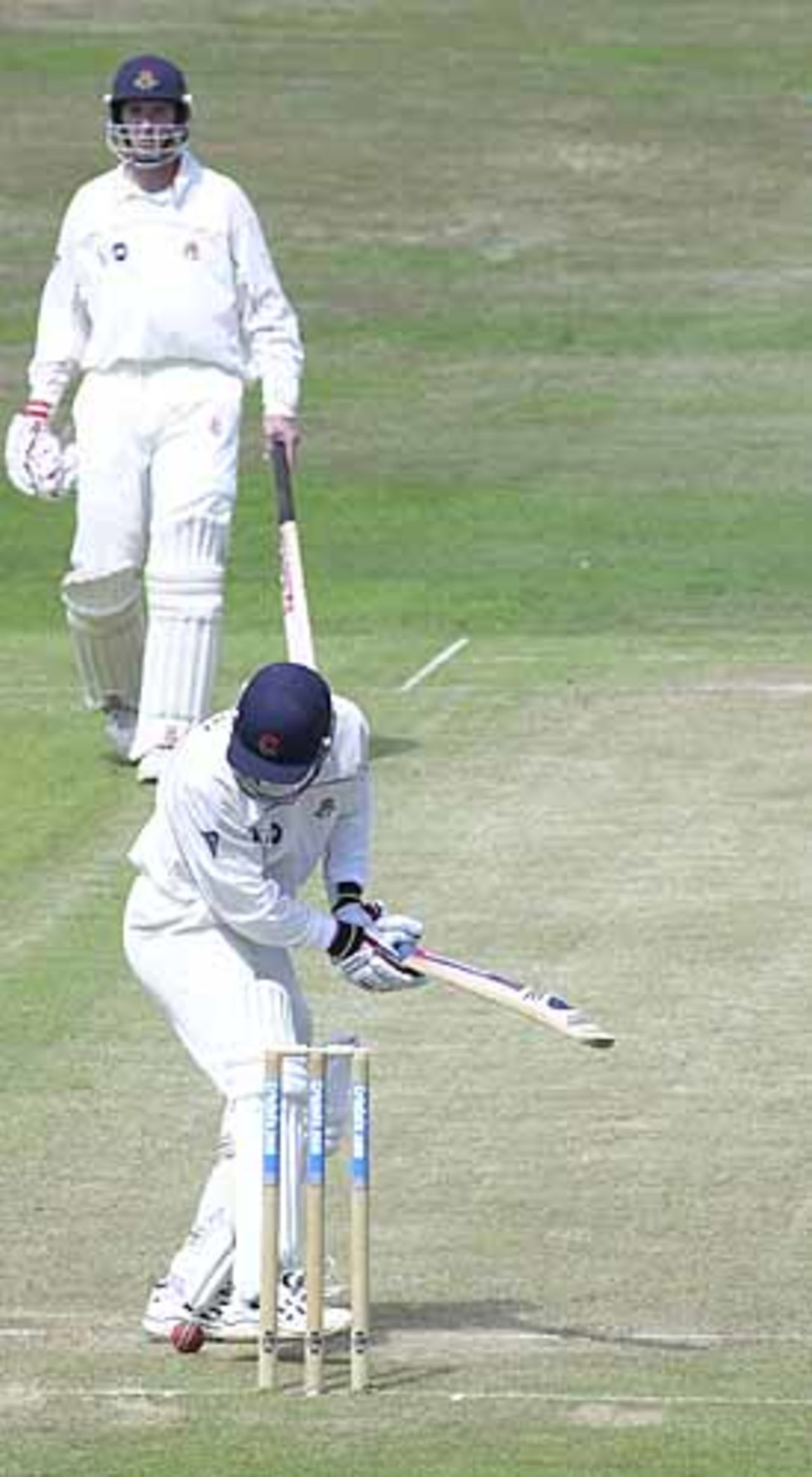 Joe Scuderi has lost this ball from Gough under his feet and is kicking it away from the stumps, CricInfo Championship, 27th July 2001, Leeds