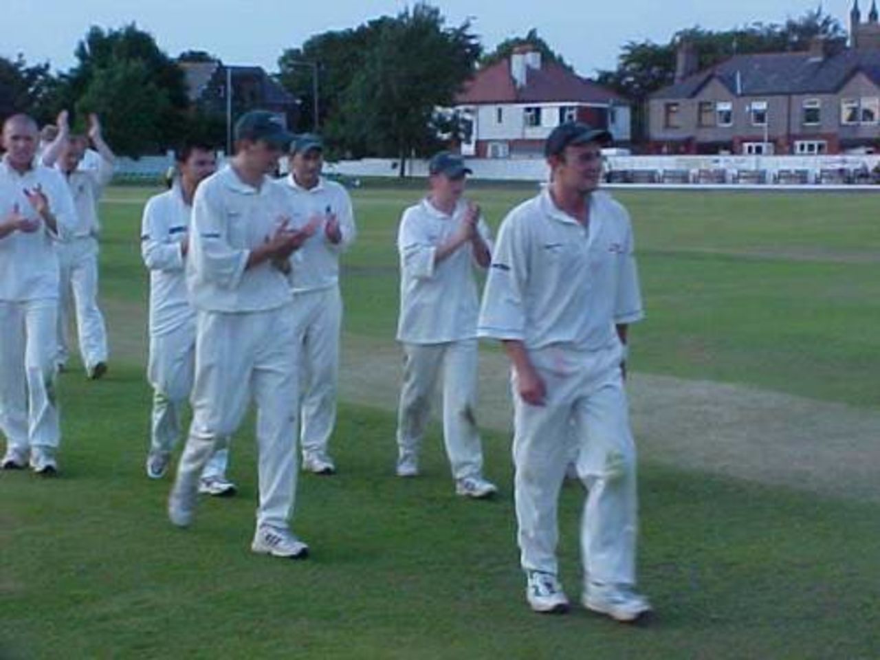 Rishton hero Scott Greaves leads the team off