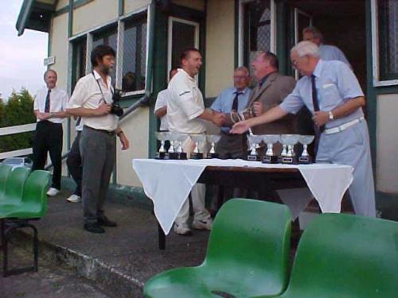 Frank Barden receives the trophy from Lancashire Evening Telegraph Sports Editor Murray Walker
