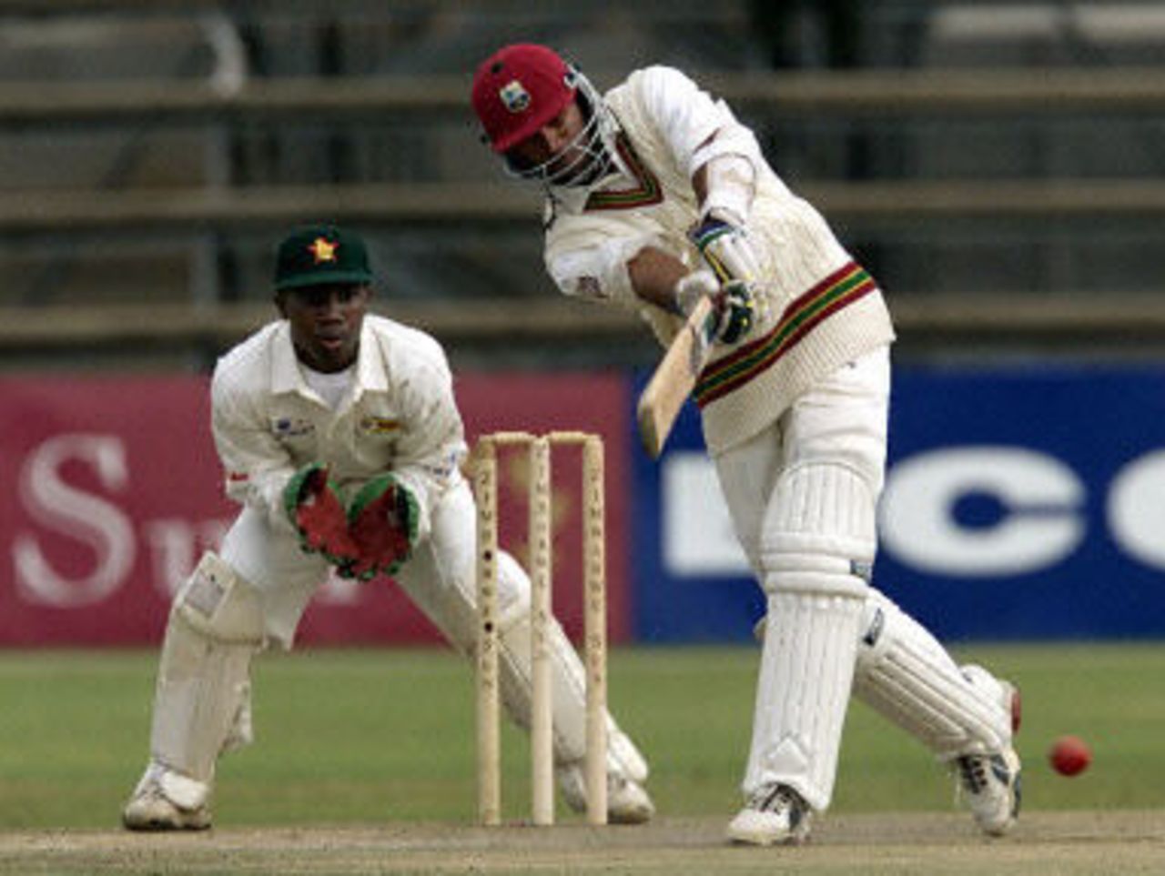 Daren Ganga drives watched by Tatenda Taibu, West Indies v Zimbabwe 2nd Test at Harare, 27-31 July 2001.
