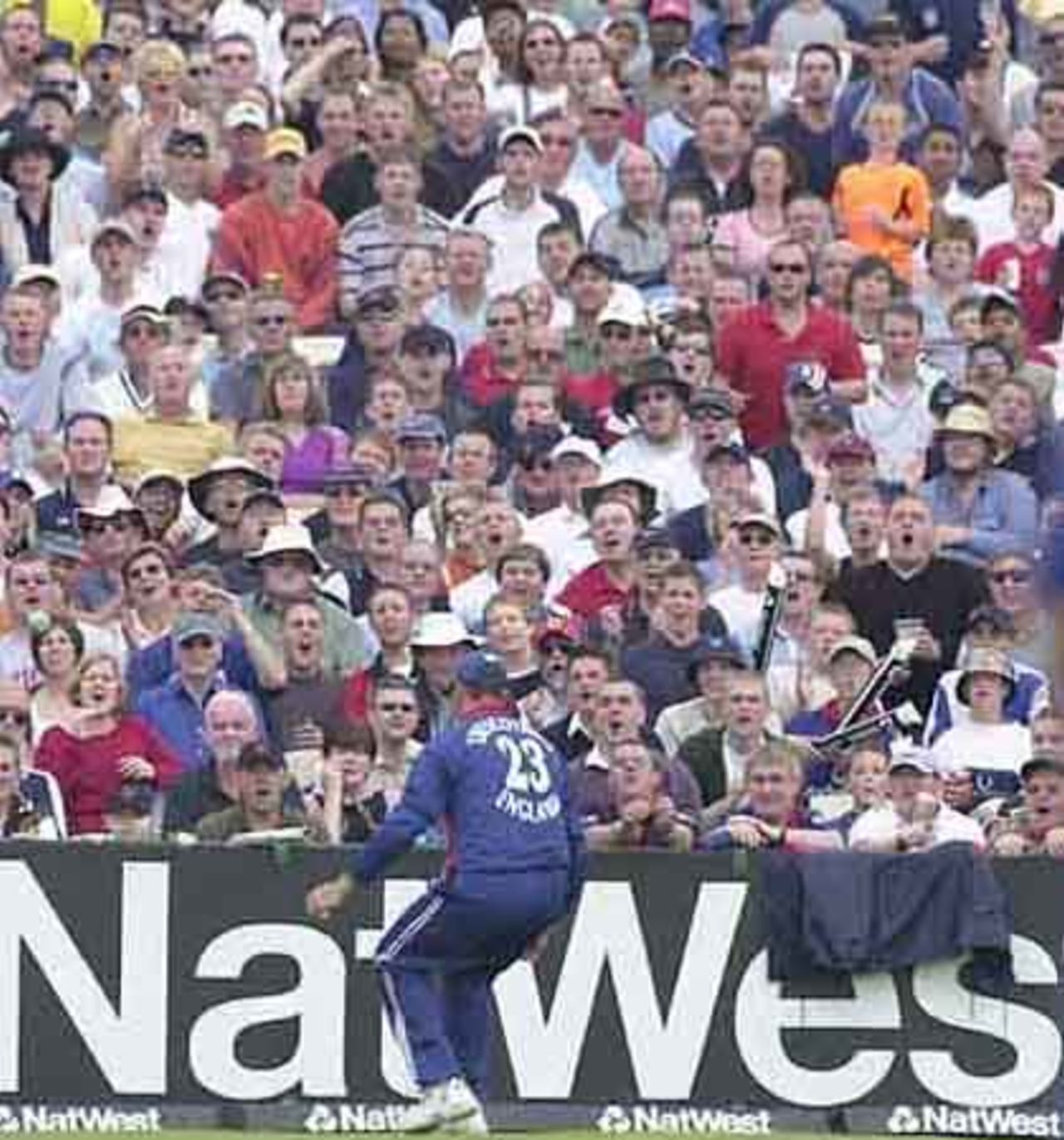Mouths open , the crowd show their reaction as Trescothick drops a skier over the rope from Zoysa.  The ball is on the left hand side.