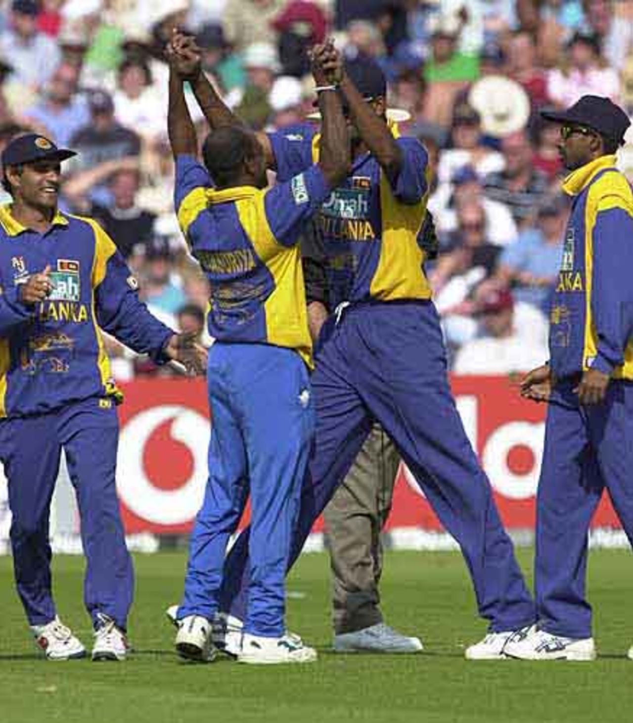The long and the short of it ; Zoysa has just caught Irani off the bowling of Jarasuriya., England v Sri Lanka at Manchester, July 2002