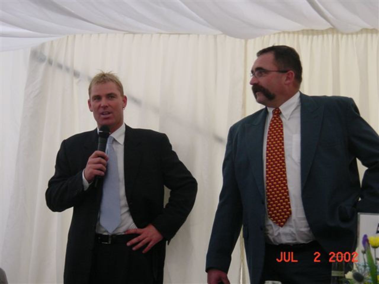 Shane Warne and Merv Hughes entertain the guests at Shaun Udal's Summer Lunch