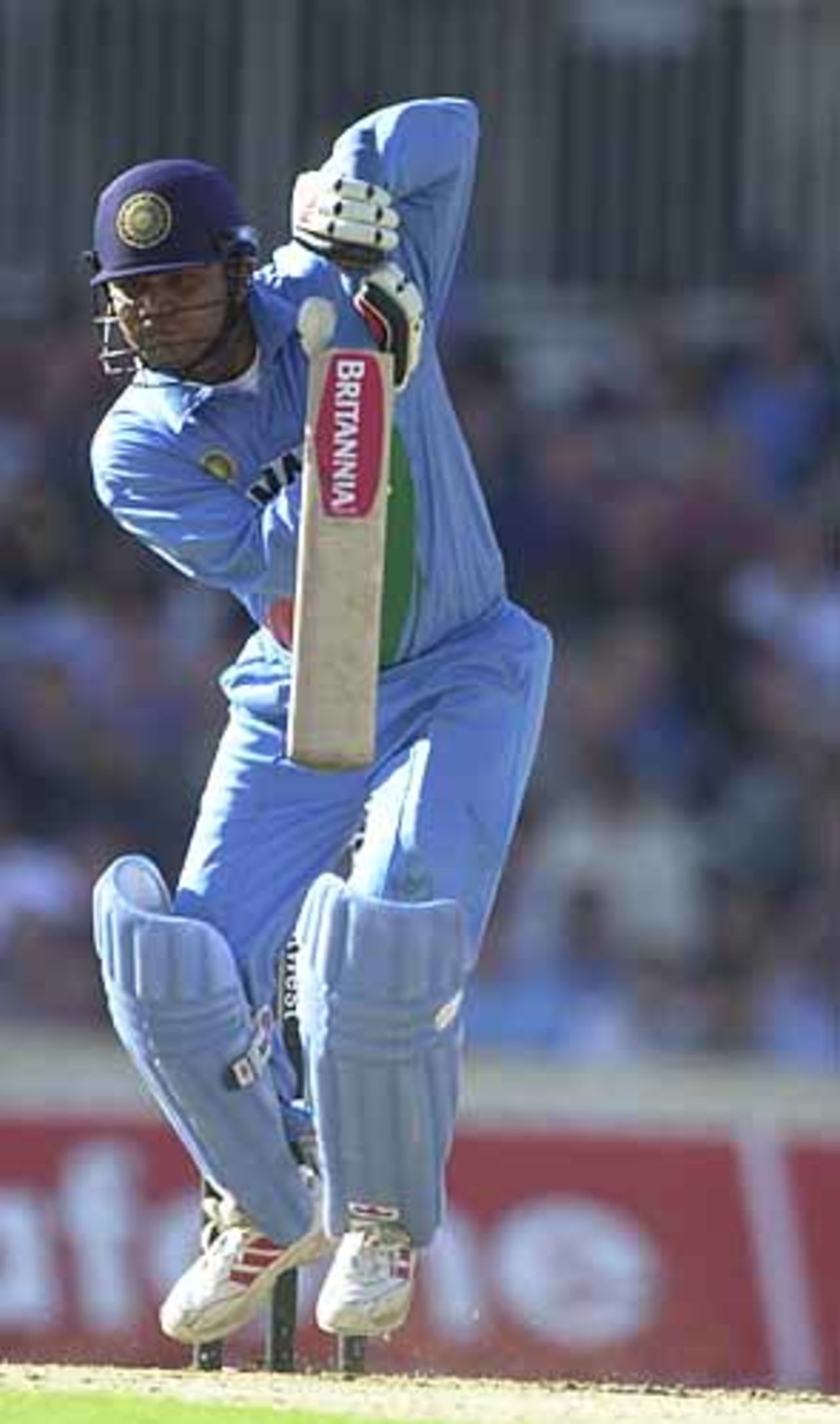 An airborne Sehwag pushes the ball to cover, England v India at The Oval, July 2002