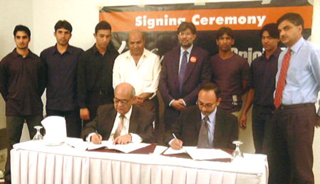 CricInfo Pakistan and Ufone contract signing, 10 July 2002 at Lahore. L-R: Imran Nazir, Misbah-ul-Haq, Azhar Mahmood, Intikhab Alam, Arshad Khan (CEO Ufone), Yousuf Youhana, Mohammad Sami, Asad Aziz (Business Unit Manager Ufone), Sitting L-R: Suhael Ahmed (CricInfo) and Salman A. Wassay (GM Mktg Ufone)