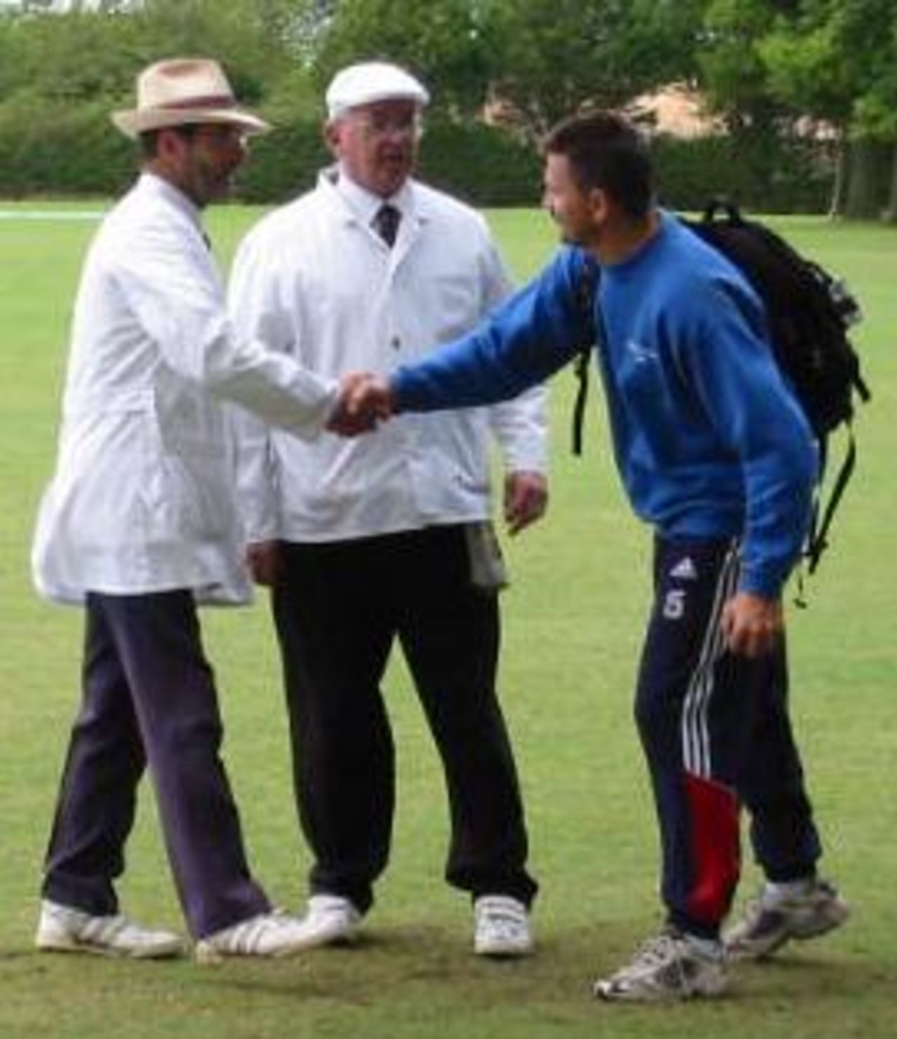 Spirit of Cricket - Danish coach Dennis Seier with the umpires
