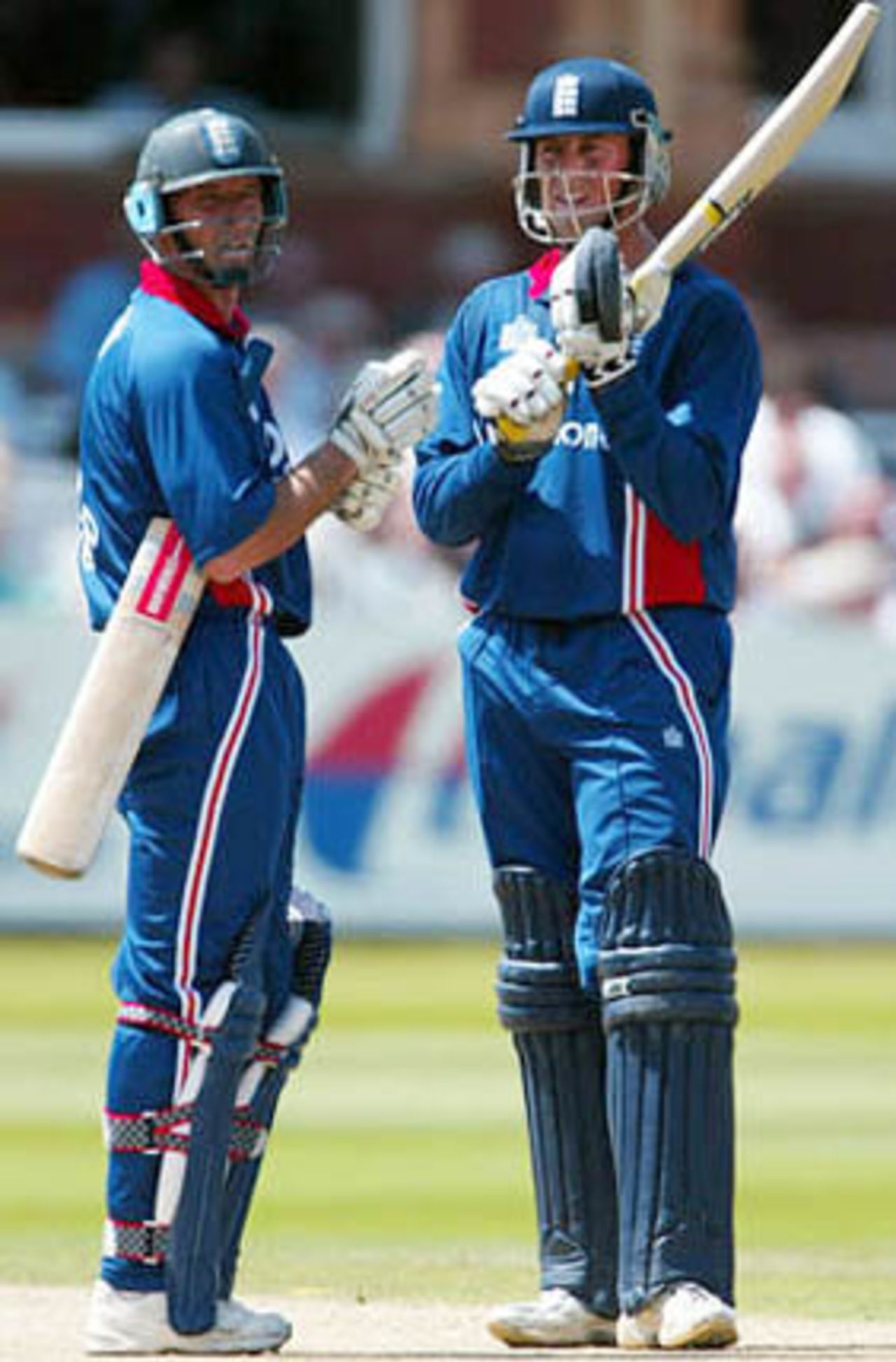 Marcus Trescothick and Nasser Hussain look at the scoreboard - the pair added 185 together