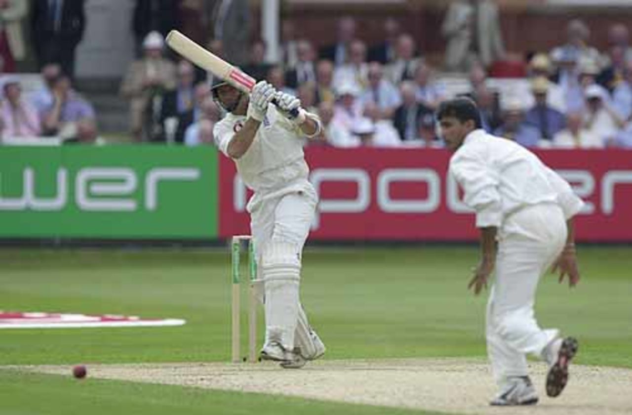 A Tale of Two Captains; Hussain drives his opposite number Ganguly to the long off boundary , England v India, 1st npower Test at Lord's