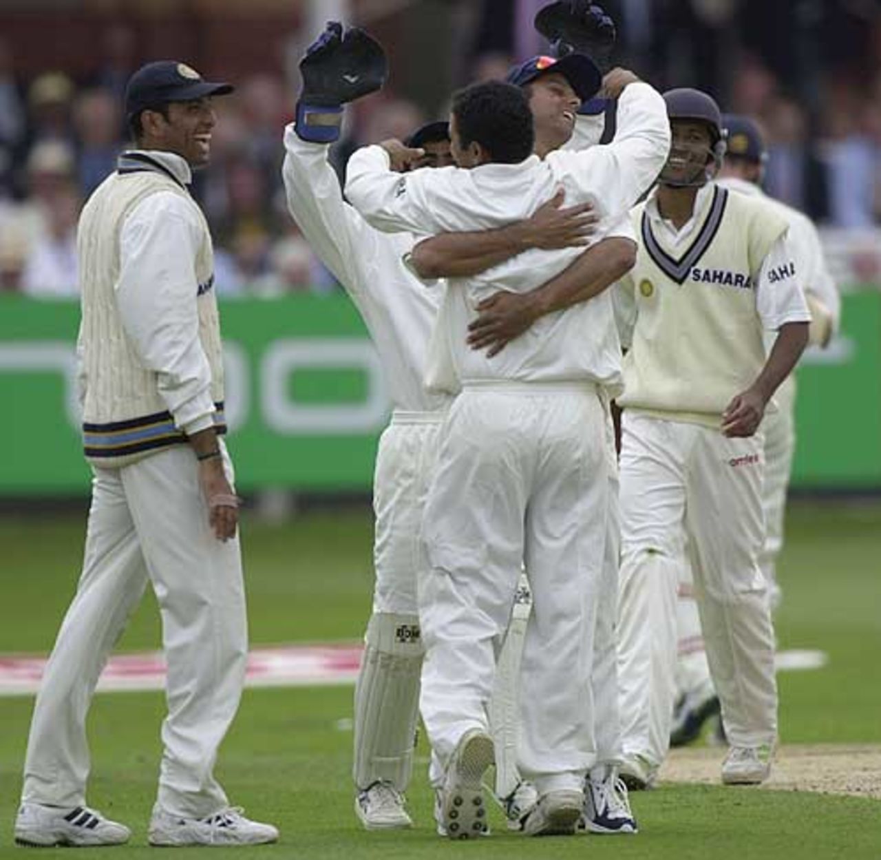 Sehwag, as a  bowler, is embraced after capturing the wicket of Crawley for 64., England v India, 1st npower Test at Lord's