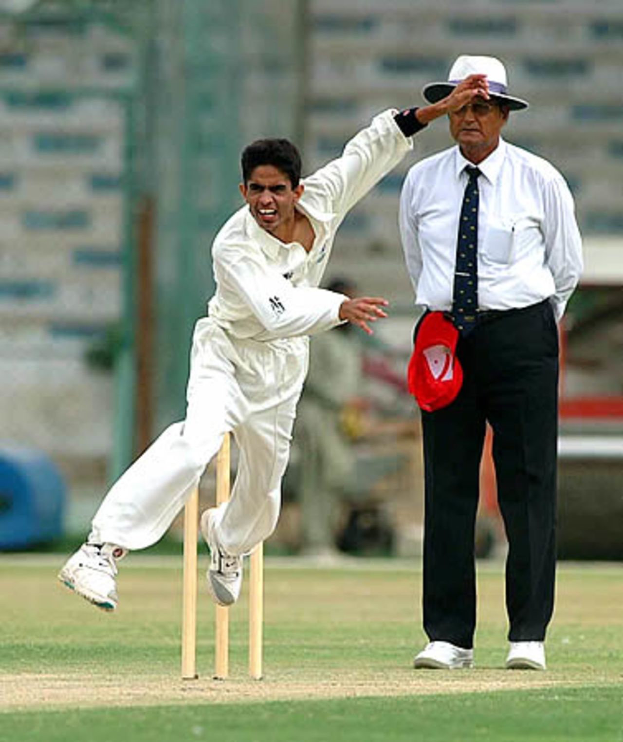 Ghulam Mustafa, Hong Kong fast bowler in action, Hong Kong Under-19s v Oman Under-19s at National Stadium Karachi, Youth Asia Cup 2003, 15 July 2003.