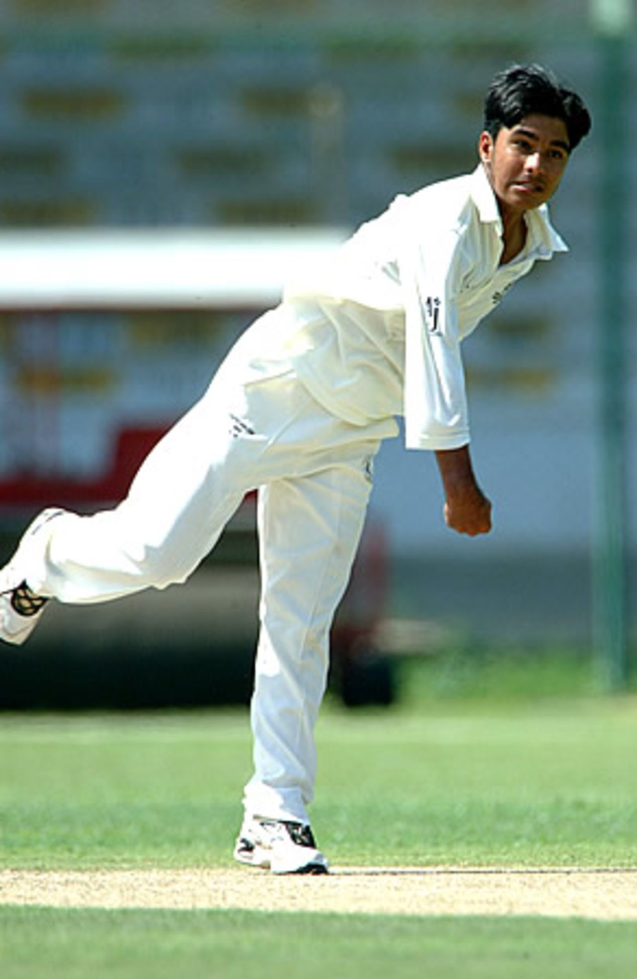 Ansar Raza, Oman in action during his haul of 4 for 9 runs, Oman Under-19s v Thailand Under-19s at National Stadium Karachi, Youth Asia Cup 2003, 19 July 2003.