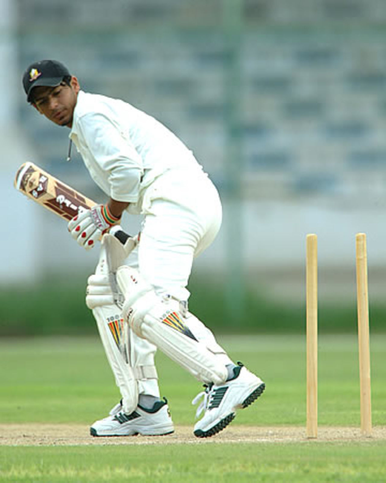 Umar Shah of UAE looks back as his middle stump is knocked out, Nepal Under-19s v United Arab Emirates Under-19s at National Stadium Karachi, Youth Asia Cup 2003, 20 July 2003.