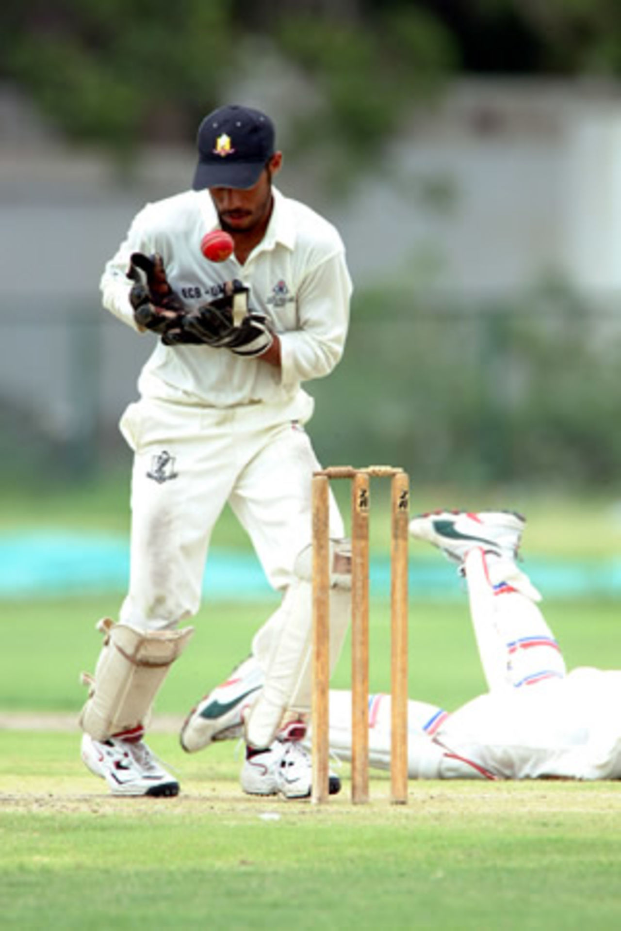 Abdul Rehman of UAE collects a ball, Maldives Under-19s v United Arab Emirates Under-19s at PCB Academy Ground Karachi, Youth Asia Cup 2003, 22 July 2003.