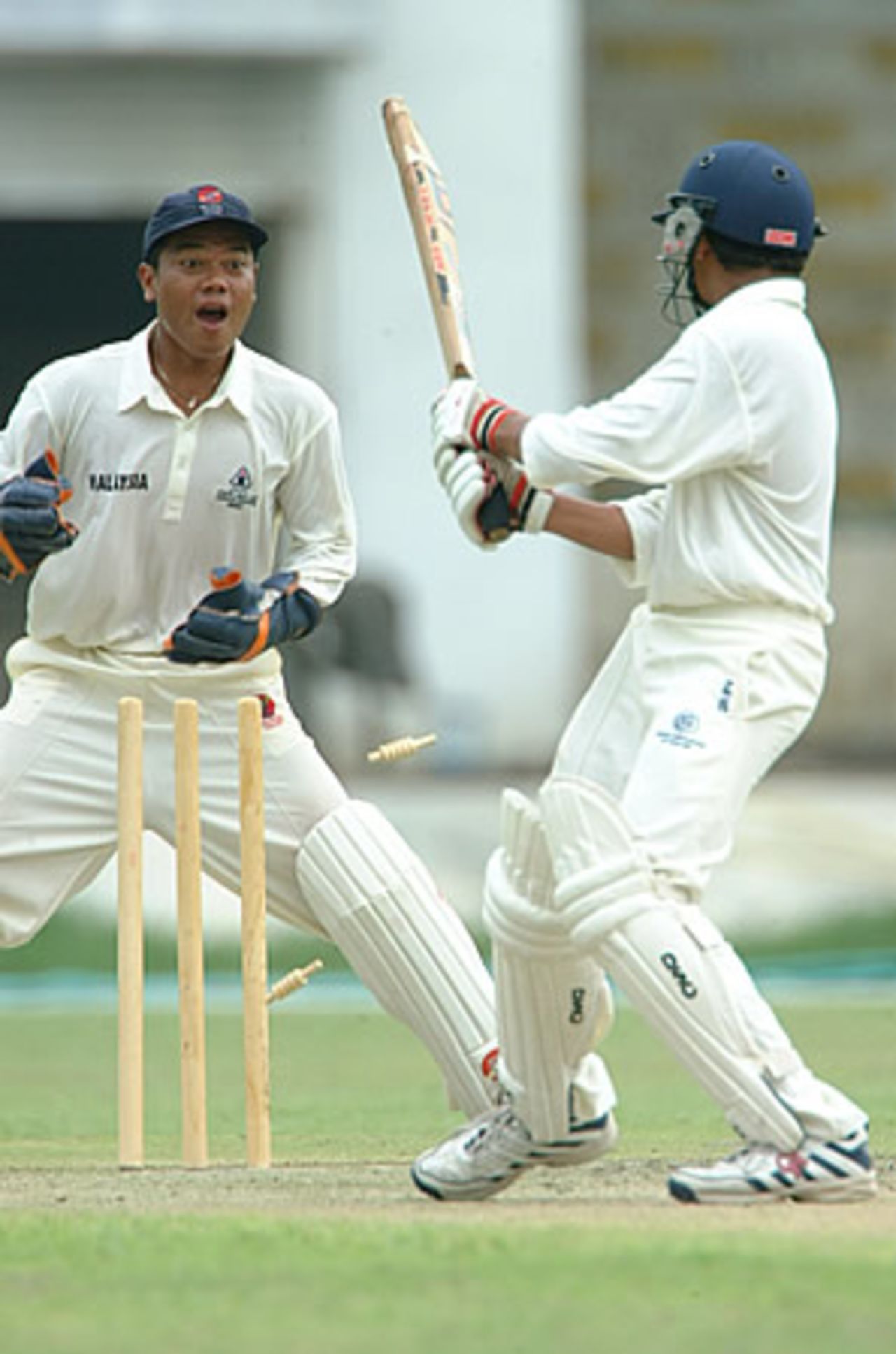 Thailand's Nishadh Thomas loses his bails, Malaysia Under-19s v Thailand Under-19s at National Stadium Karachi, Youth Asia Cup 2003, 23 July 2003.