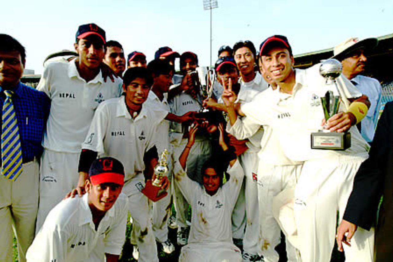 Nepal team celebrate with winner's trophy, Final: Malaysia Under-19s v Nepal Under-19s at National Stadium, Karachi, Youth Asia Cup 2003, 27 July 2003.