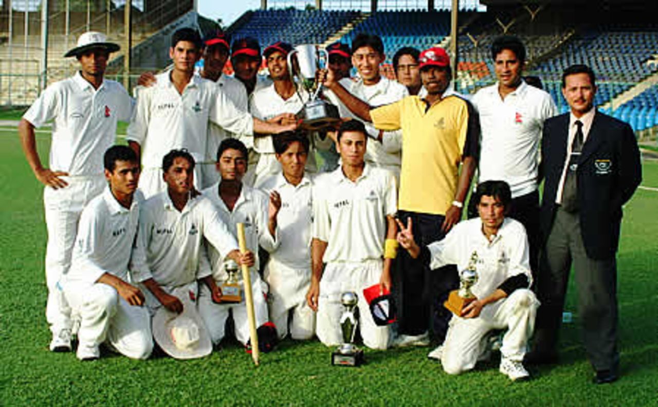 Nepal team pose with winner's trophy, Final: Malaysia Under-19s v Nepal Under-19s at National Stadium, Karachi, Youth Asia Cup 2003, 27 July 2003.