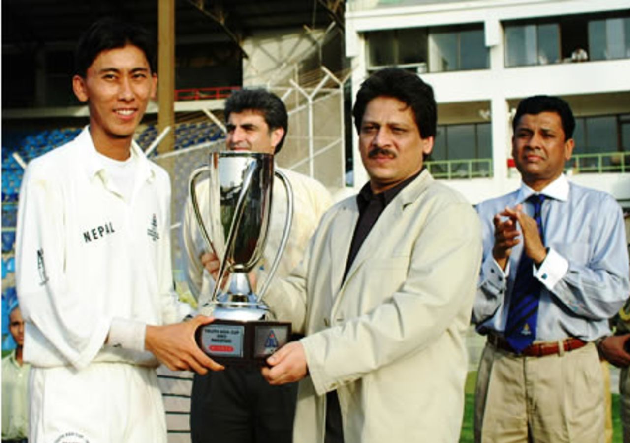 Winning captain Shakti Prasad of Nepal receives the trophy from Sindh Governor, Final: Malaysia Under-19s v Nepal Under-19s at National Stadium, Karachi, Youth Asia Cup 2003, 27 July 2003.