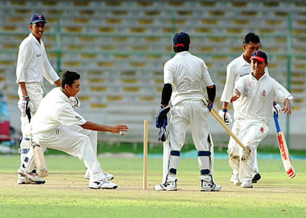 Nepal team players go for trophies after the win, Final: Malaysia Under-19s v Nepal Under-19s at National Stadium, Karachi, Youth Asia Cup 2003, 27 July 2003.